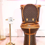 The central work to artist Illma Gore’s exhibit with boutique Tradesy is a Louis Vuitton leather-clad, golden toilet